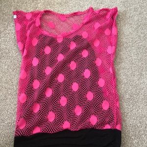 Black thank top inside and a pink net see thru outside. Is sleeveless